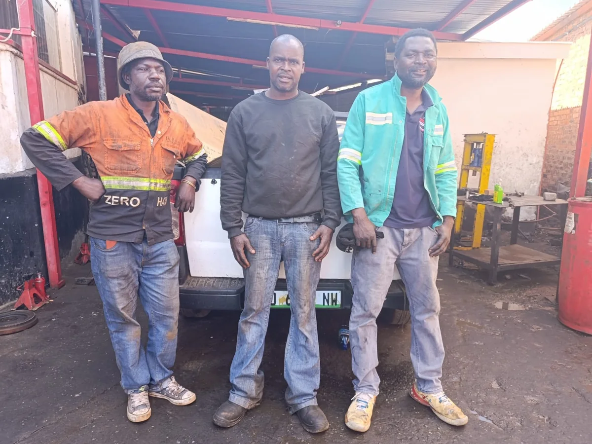 Wawo, Booster and Chris at Metro Chris AutoWorks workshop
